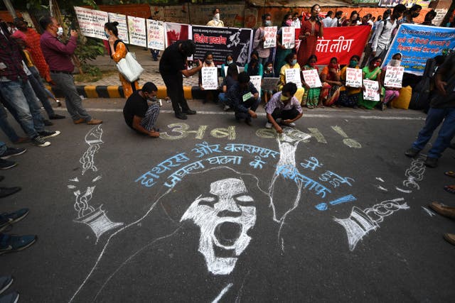 <p>File. Demonstrators paint a floor mural to protest against rape in India</p>