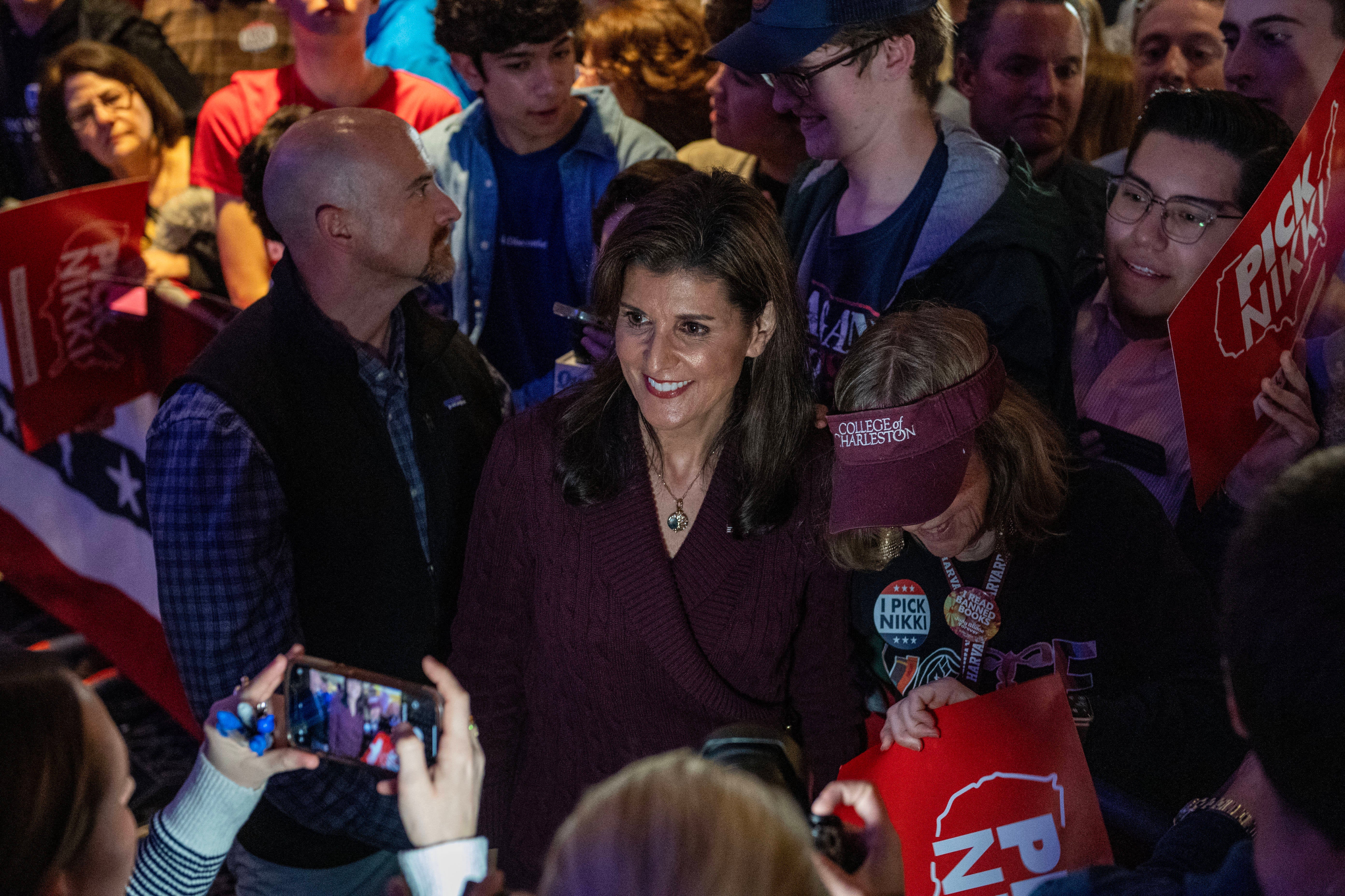 US Republican presidential hopeful and former UN Ambassador Nikki Haley takes pictures with supporters during a campaign rally in Needham, Massachusetts, on March 2, 2024