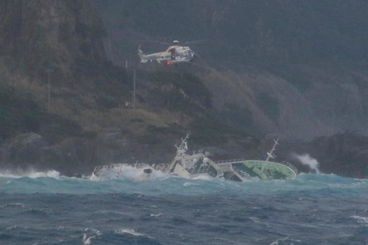 24 fishermen rescued from half-submerged ship in rough seas off Japanese island, but 1 found dead