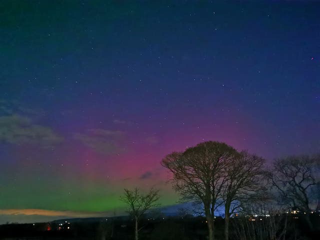 <p>The aurora borealis, also known as the northern lights, over Grimsargh Wetlands in Lancashire</p>