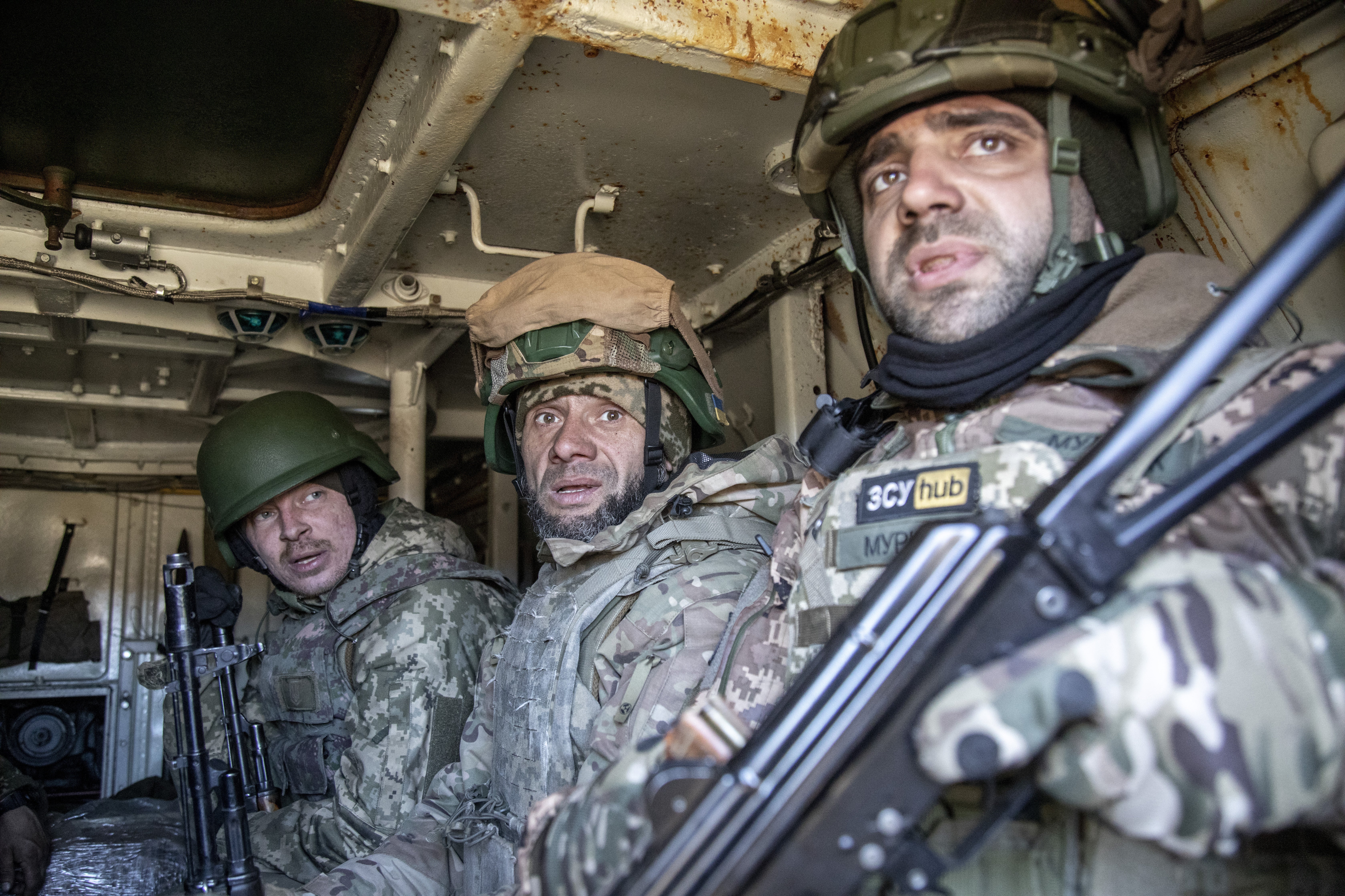 Ukrainian servicemen belonging to infantry battalion of 42 Brigade are seen inside an armored vehicle during a maintenance training