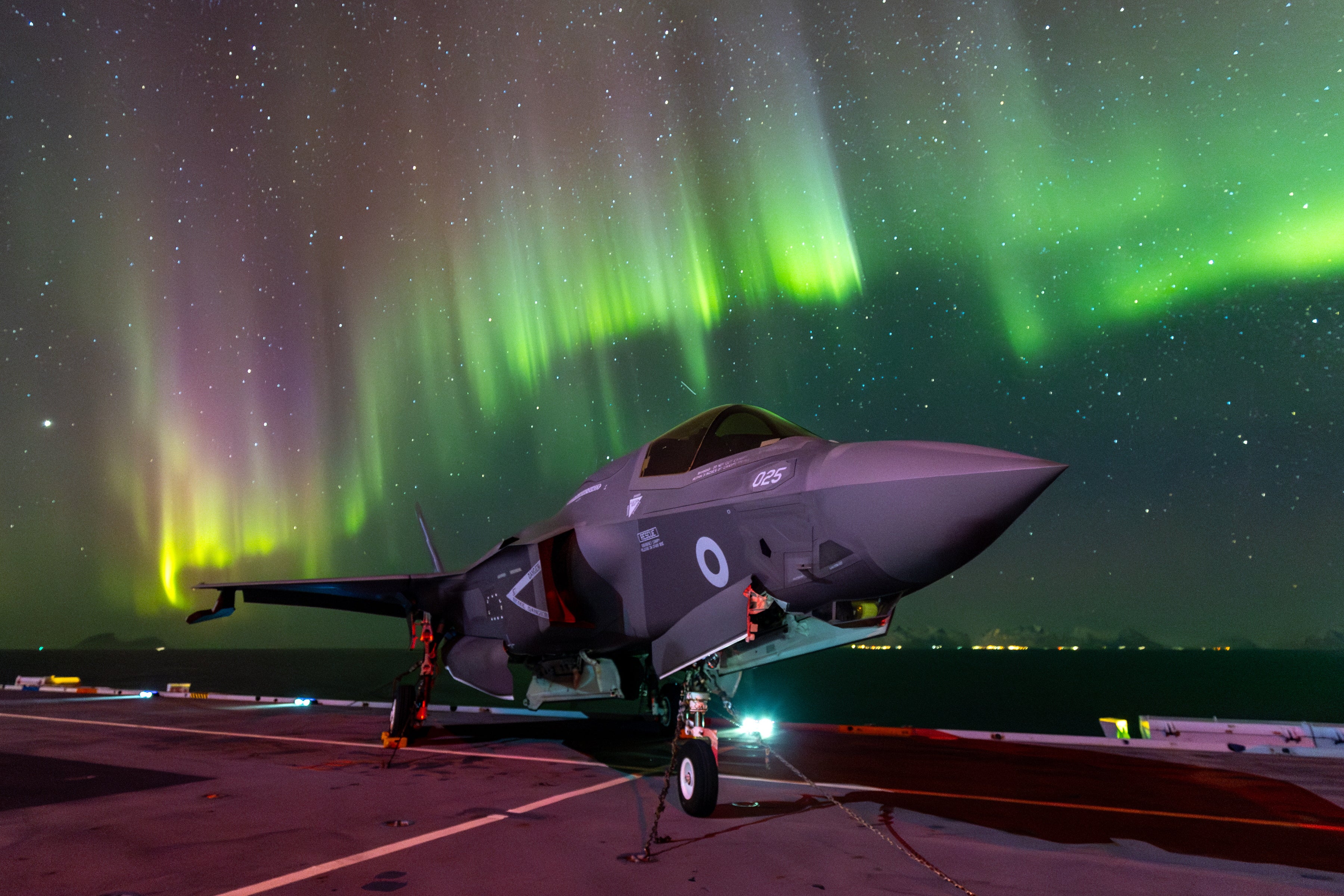 Ministry of Defence handout photo of F-35B lightning jets flight deck of HMS Prince of Wales under the northern lights