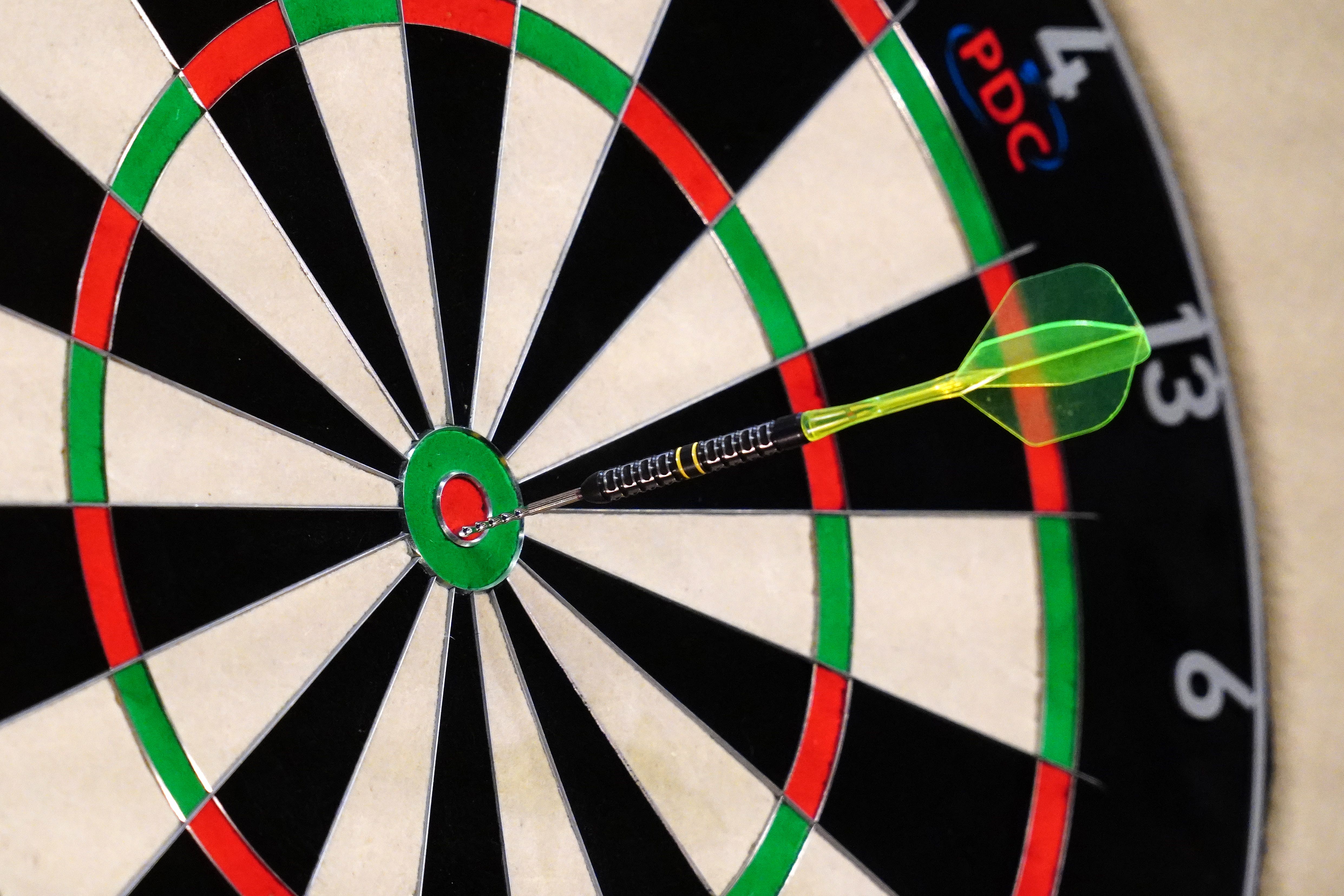 A dart in a dartsboard (David Davies/PA)