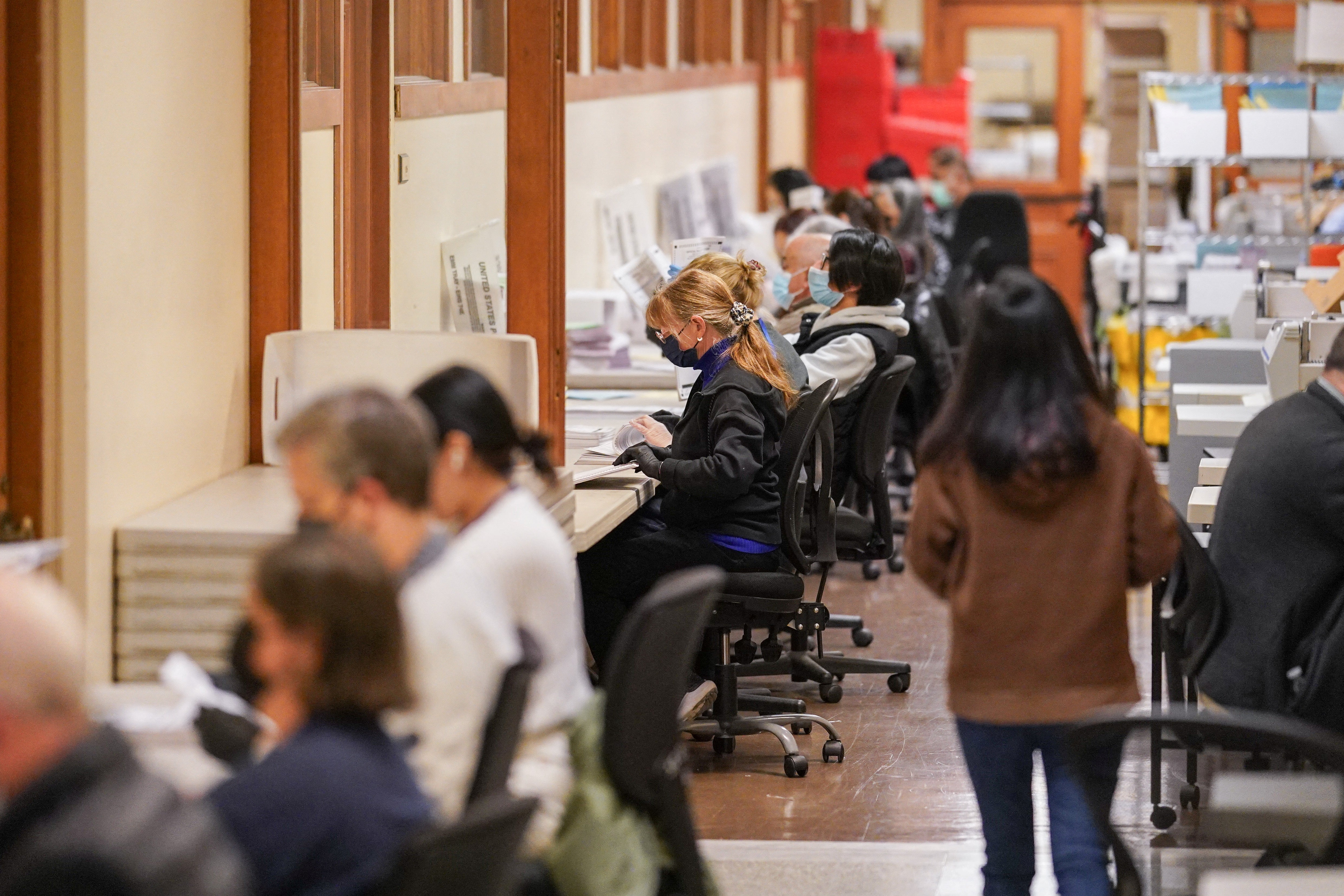 <p>Election personnel process ballots during early voting, a day ahead of the Super Tuesday primary election, at the San Francisco City Hall voting center in San Francisco, California, U.S. March 4, 2024</p>