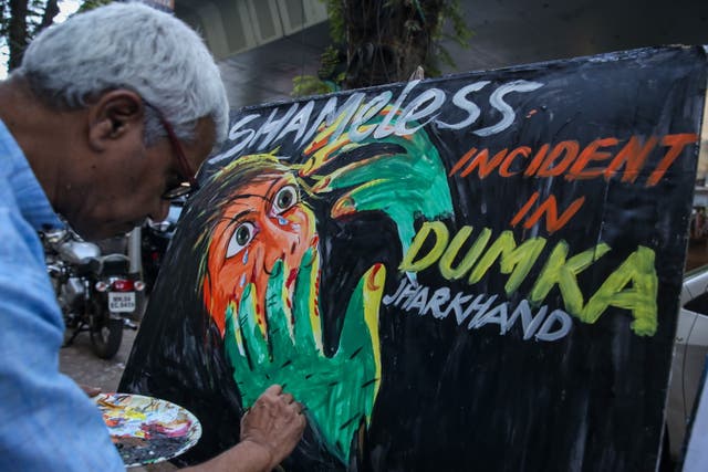 <p>An artist draws a painting demanding action in connection with the gang-rape of a popular Spanish tourist in India’s Dumka </p>