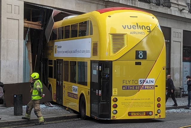 <p>The yellow double decker smashed into a building in New Oxford Street, which has been closed as a result </p>
