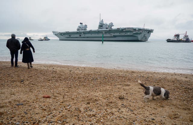 <p>The Royal Navy aircraft carrier HMS Queen Elizabeth leaves Portsmouth Harbour </p>