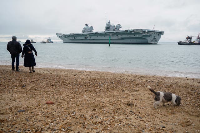 <p>The Royal Navy aircraft carrier HMS Queen Elizabeth leaves Portsmouth Harbour </p>
