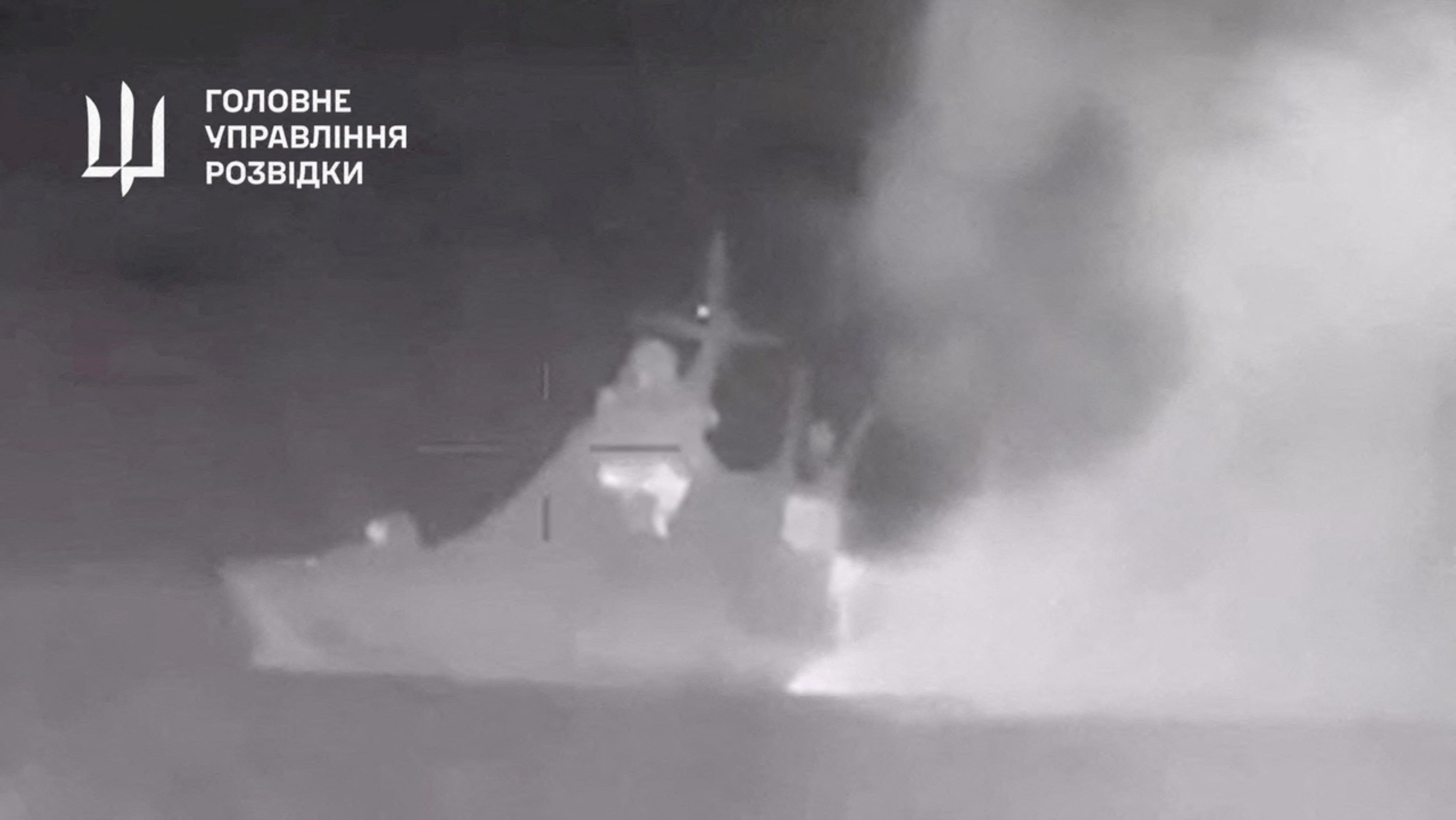 Handout footage shows smoke rising from what Ukrainian military intelligence said is the Russian Black Sea Fleet patrol ship Sergey Kotov that was damaged by Ukrainian sea drones