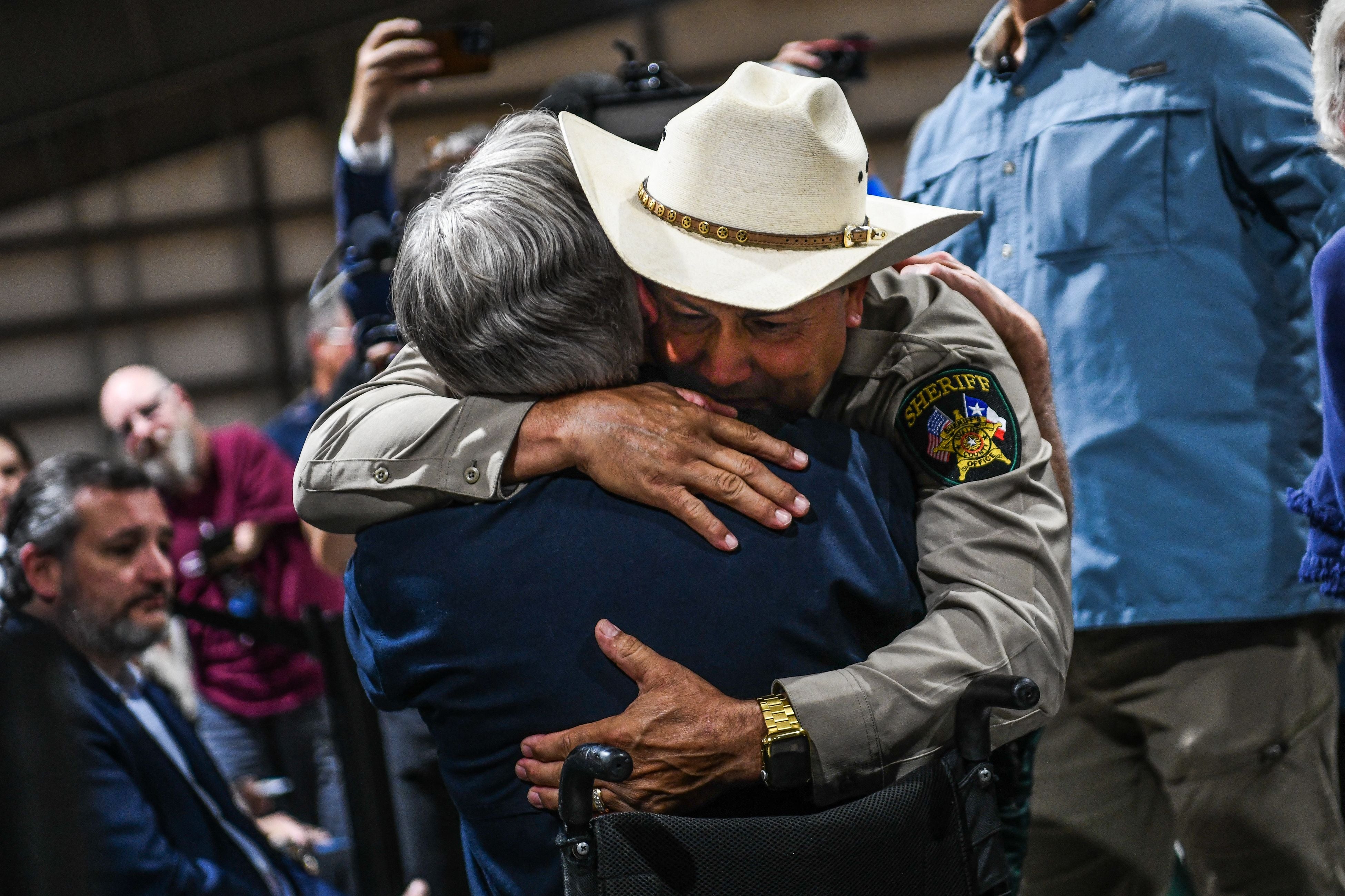 Uvalde County Sheriff Ruben Nolasco hugs Governor Greg Abbott in 2022.
