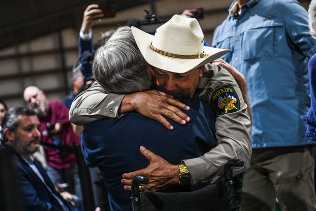 <p>Uvalde County Sheriff Ruben Nolasco hugs Governor Greg Abbott in 2022.</p>