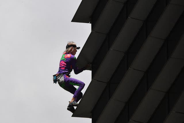 <p>French urban free-climber Alain Robert, popularly known as the "French Spiderman", climbs on the side of the 47-storey GT Tower in Manila's financial district of Makati </p>