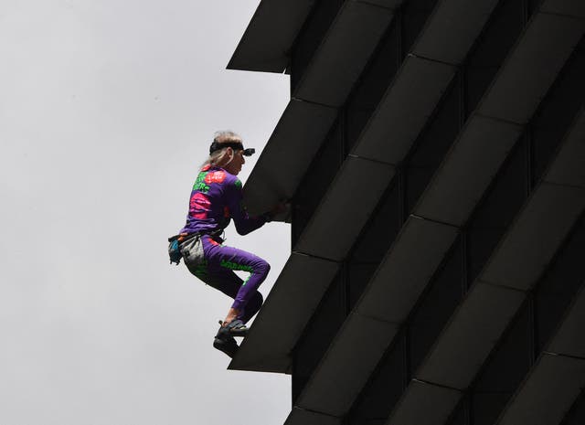 <p>French urban free-climber Alain Robert, popularly known as the "French Spiderman", climbs on the side of the 47-storey GT Tower in Manila's financial district of Makati </p>