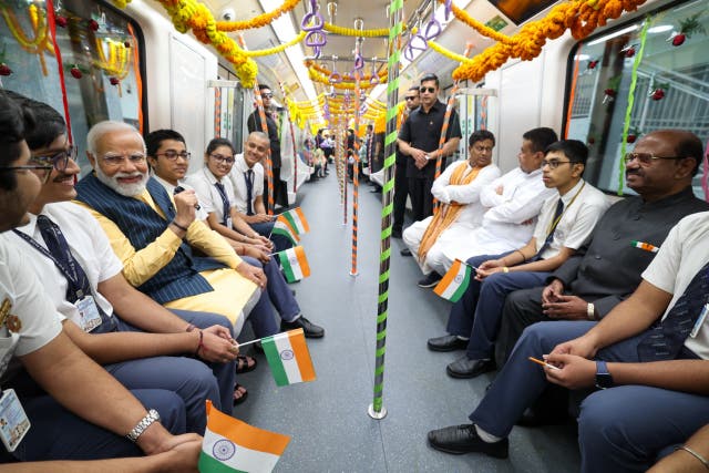 <p>India prime minister Narendra Modi takes a metro rail ride in Kolkata with school students</p>