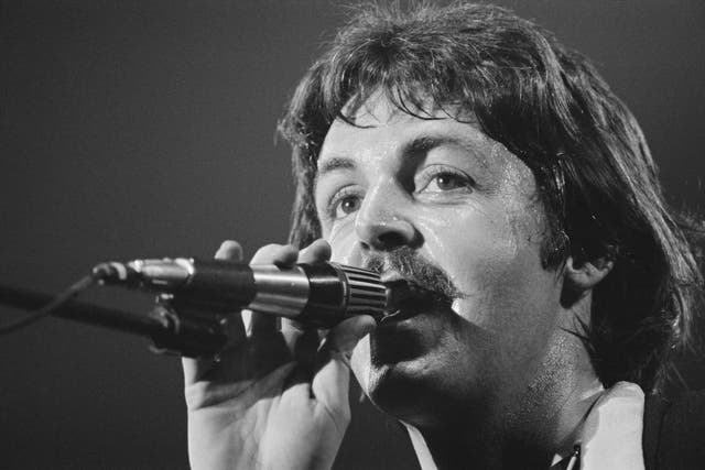 <p>Paul McCartney performing with Wings in 1976</p>
