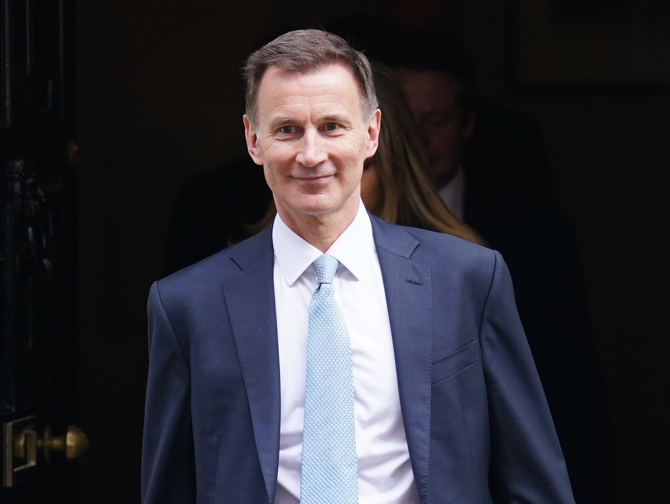 Jeremy Hunt halts HMRC plans to close phone lines for six months a