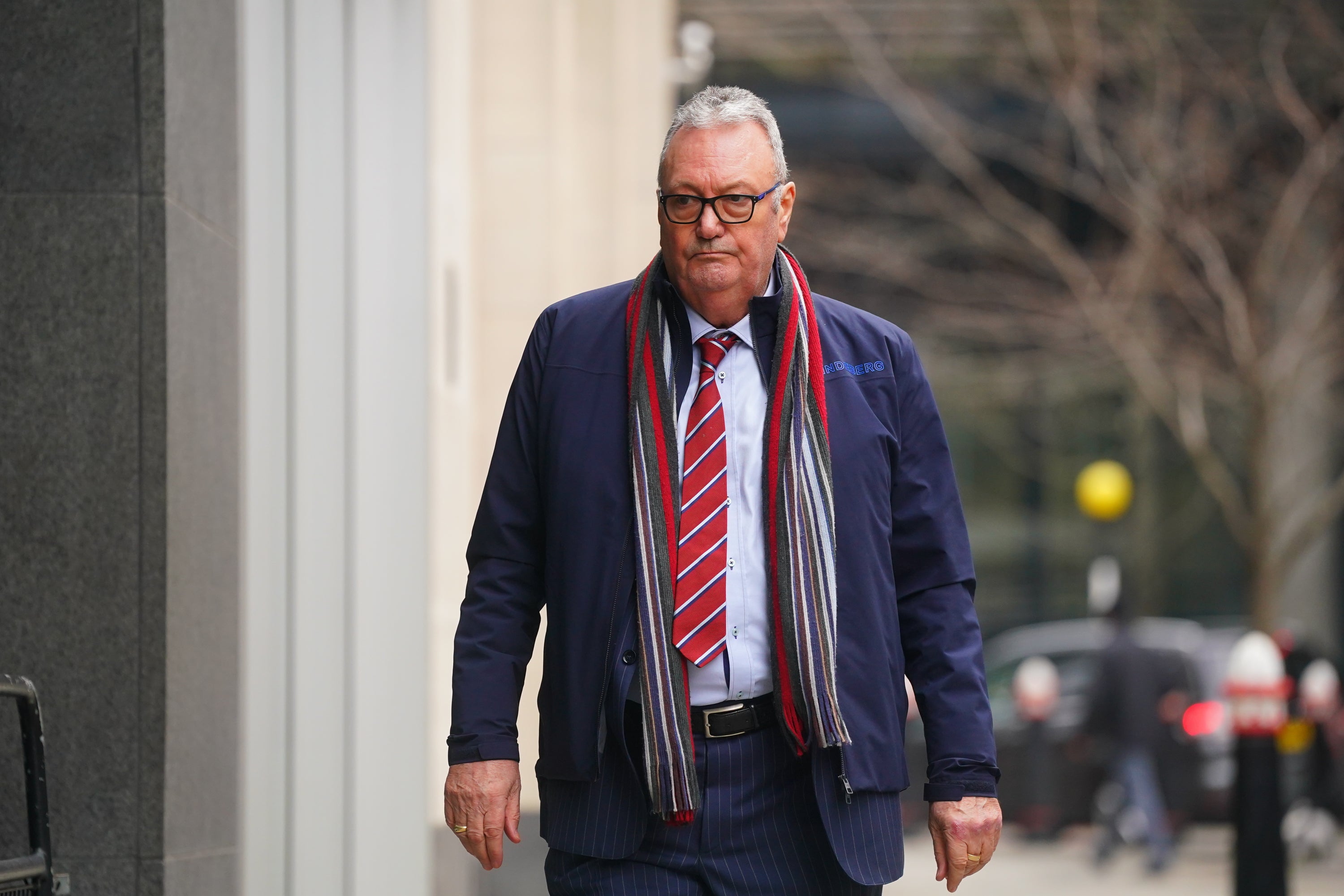 Geoffrey Stunt, the father of James Stunt arrives, at the Rolls Building, in London