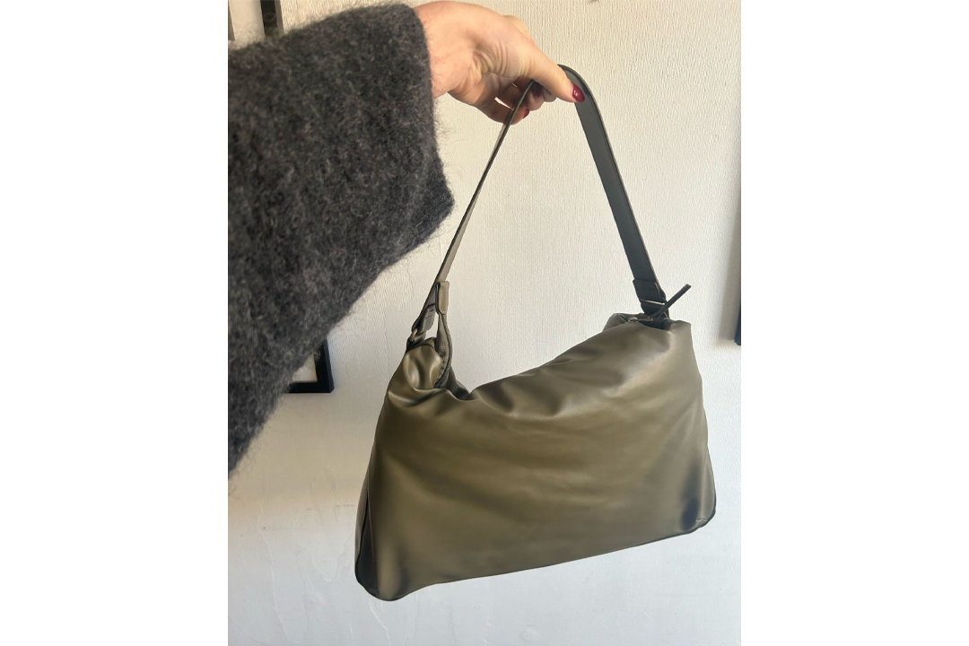 The khaki puffy bag with our laptop inside