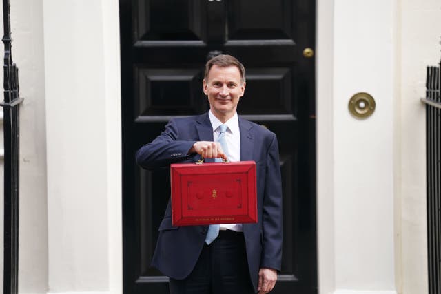<p>Chancellor of the Exchequer Jeremy Hunt leaves 11 Downing Street, London, with his ministerial box before delivering his Budget in the Houses of Parliament (James Manning/PA)</p>