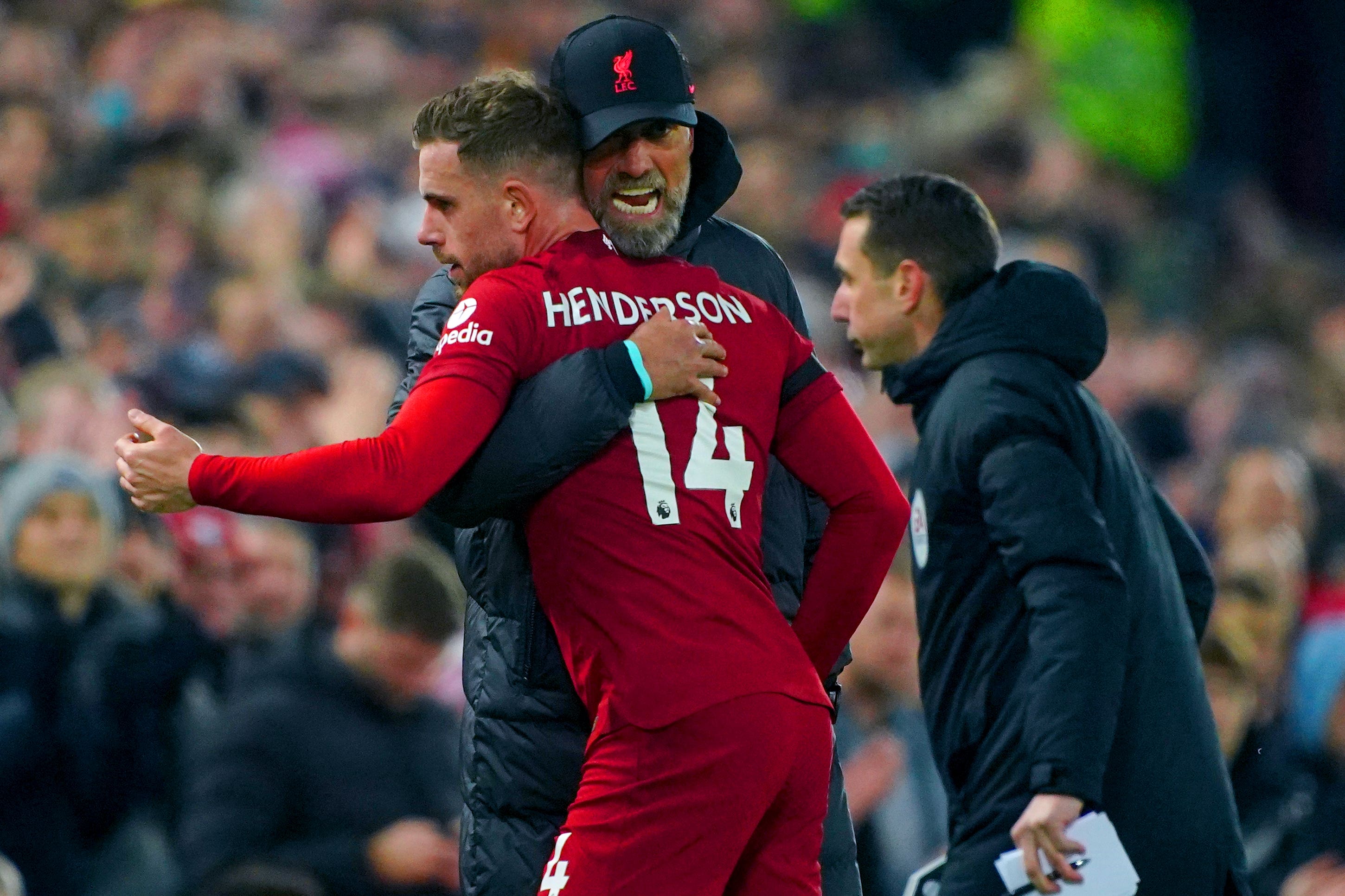 Jordan Henderson is hugged by manager Jurgen Klopp after being substituted during last year’s Merseyside derby at Anfield (Peter Byrne/PA).