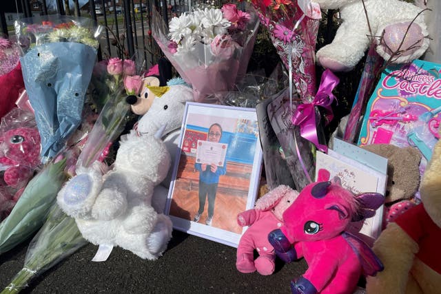 Floral tributes to 10-year-old Shay Kang placed near her home (Matthew Cooper/PA)