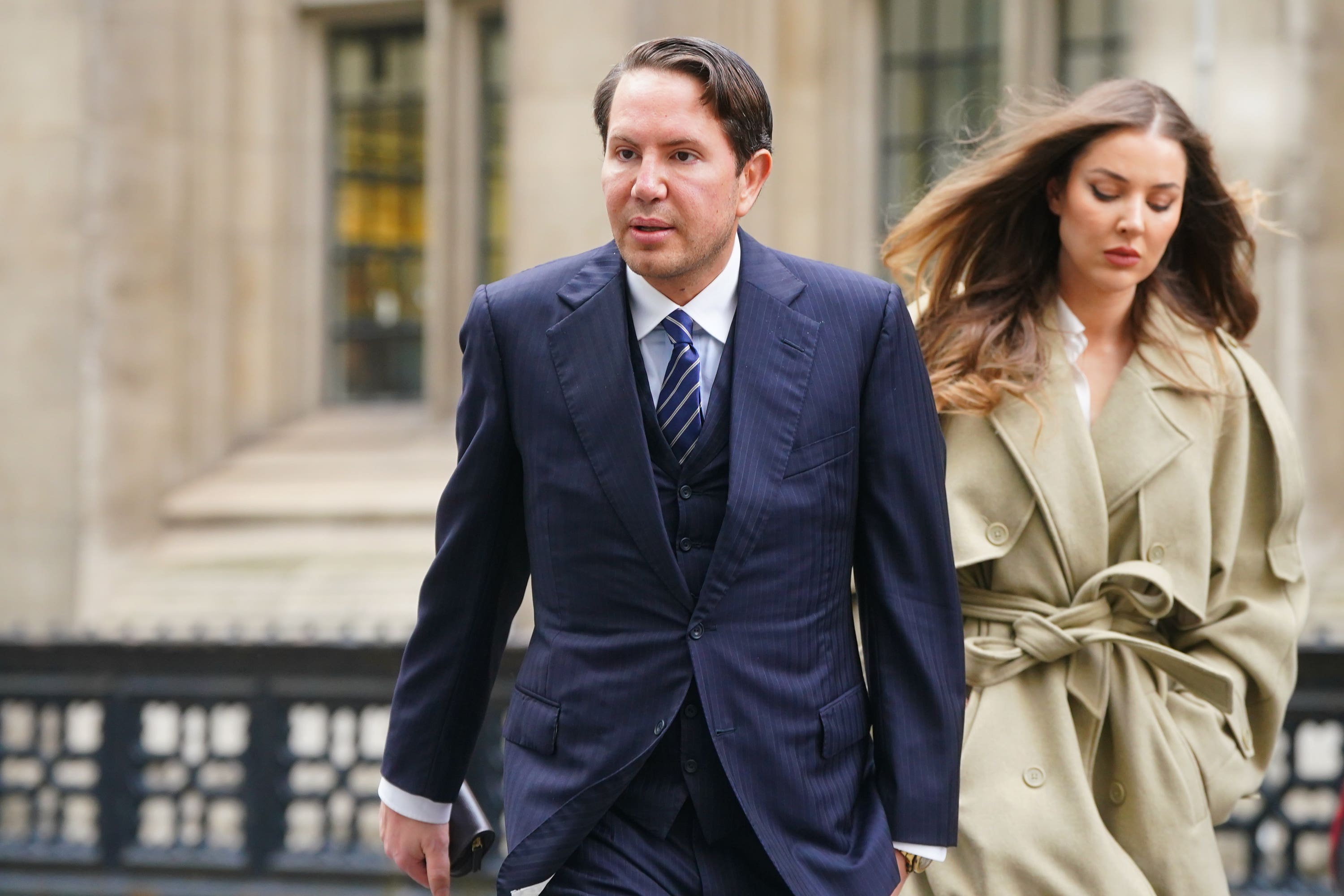 James Stunt arrives with partner Helena Robinson at the Rolls Building in London on Wednesday (Victoria Jones/PA)