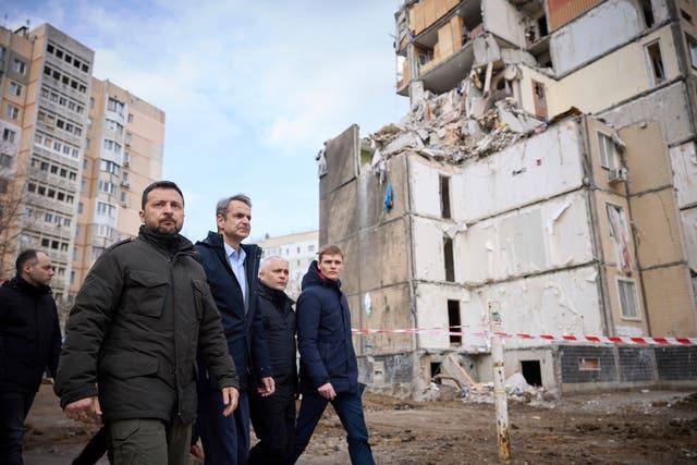 <p>Ukrainian President Volodymyr Zelenskyy, second from left, and Greece's Prime Minister Kyriakos Mitsotakis, third from left, walk in a residential area damaged by Russian attack in Odesa, Ukraine </p>
