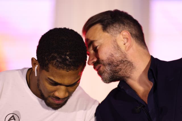 <p>Anthony Joshua (left) with his promoter Eddie Hearn </p>