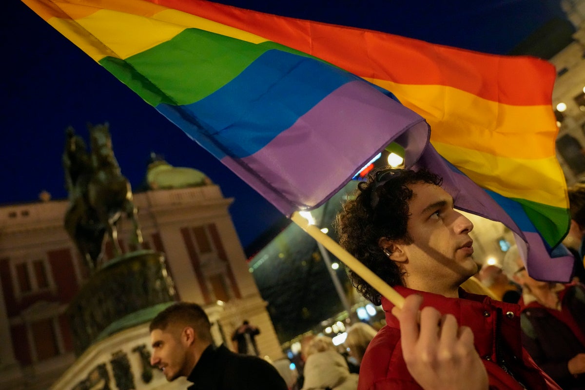 Activists and members of Serbia's LGBTQ+ community protest reported police harassment