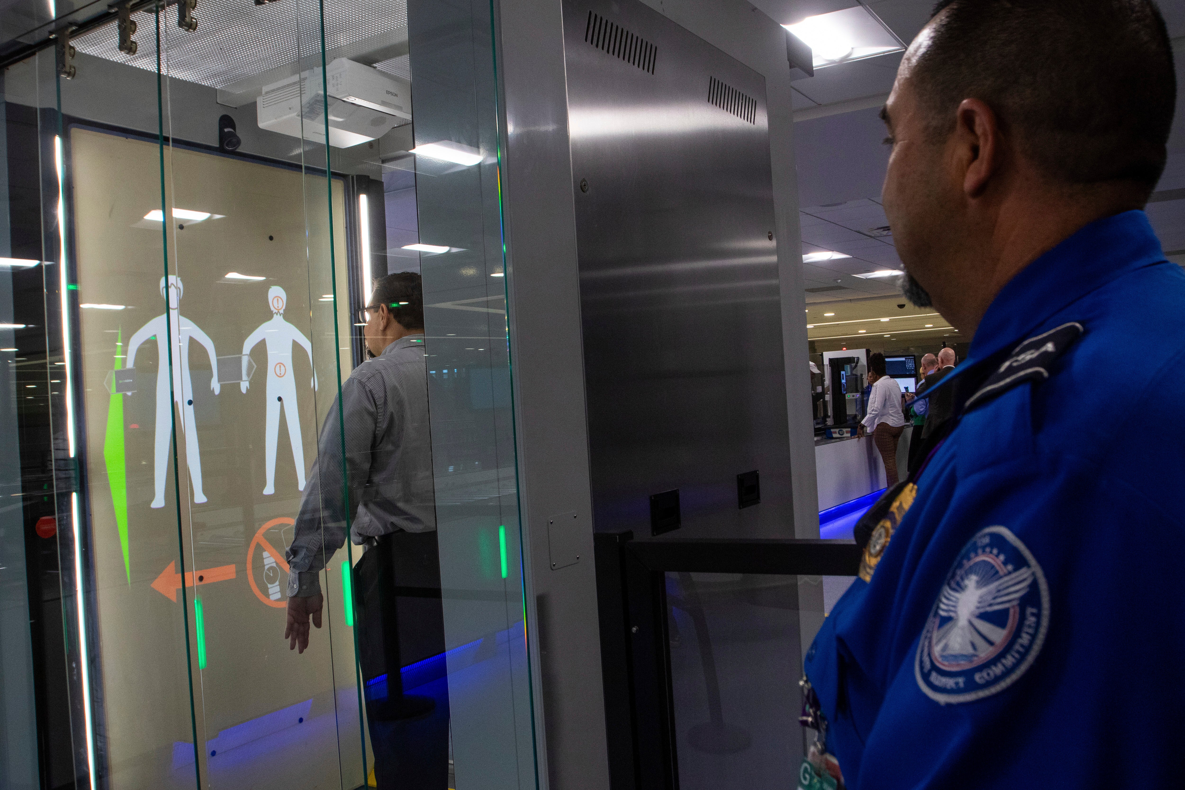 TSA officials demonstrate new screening equipment at Harry Reid International Airport, Wednesday, March 6, 2024