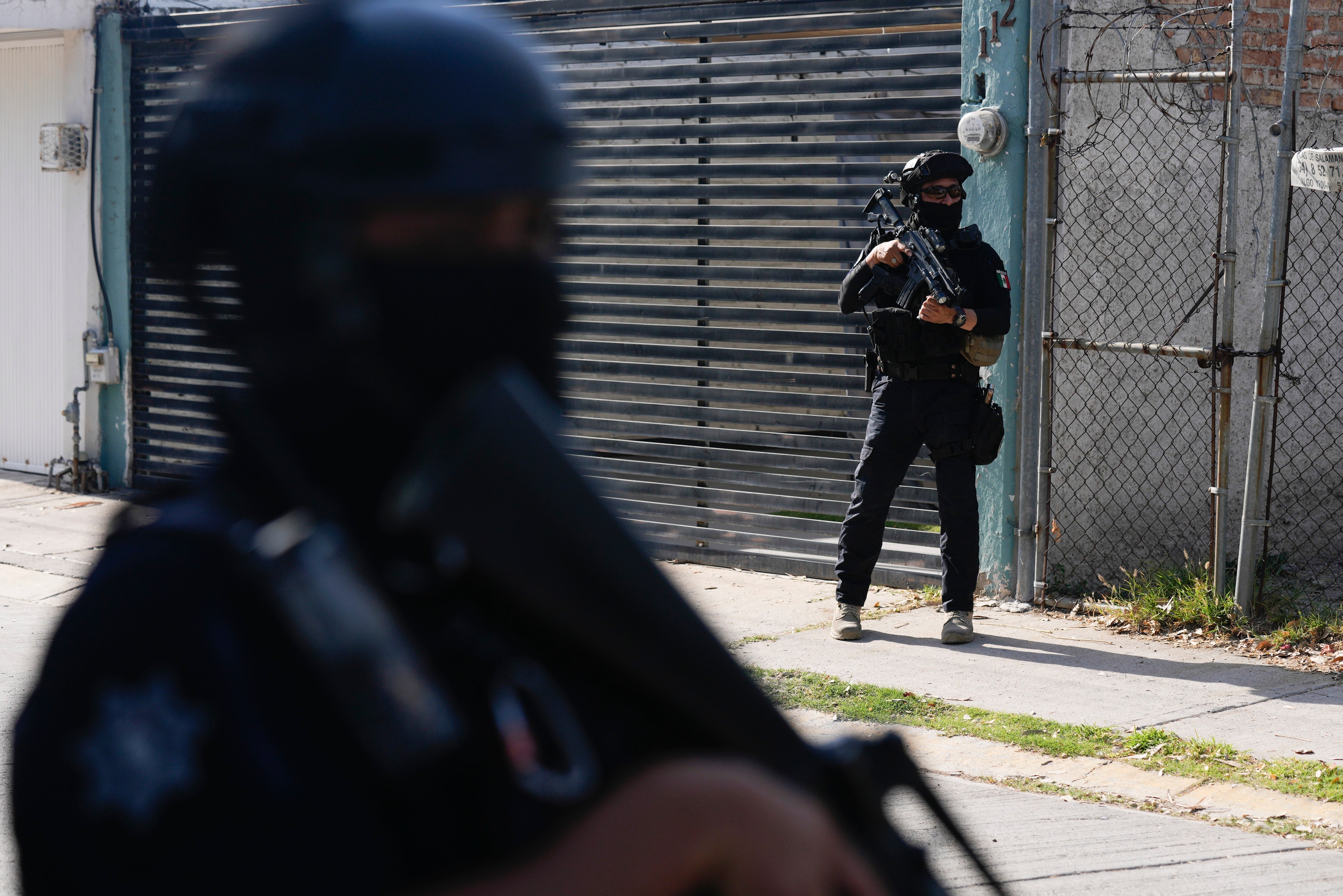 Mexico Police Under Municipal police officers on patrol in a neighborhood of Celaya, Mexico