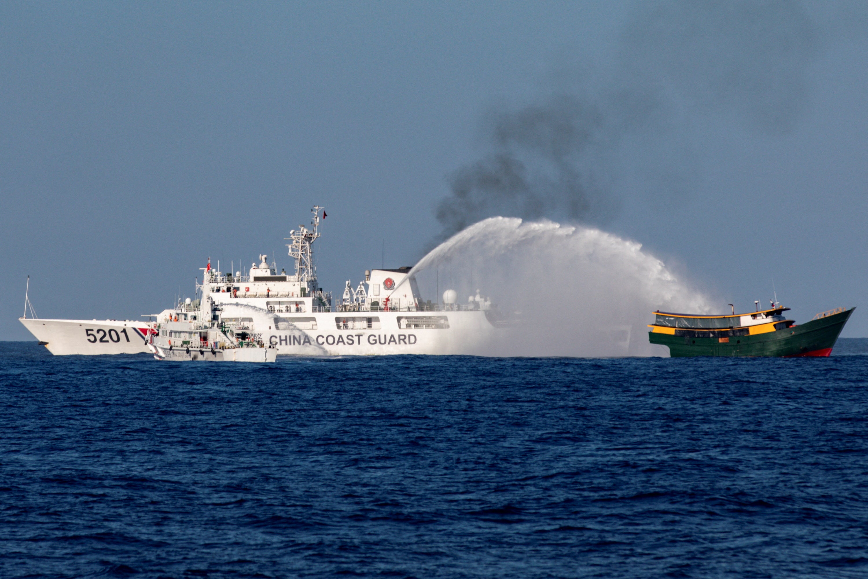 Chinese Coast Guard vessels fire water cannons towards a Philippine resupply vessel Unaizah May 4 on its way to a resupply mission at Second Thomas Shoal in the South China Sea, 5 March 2024