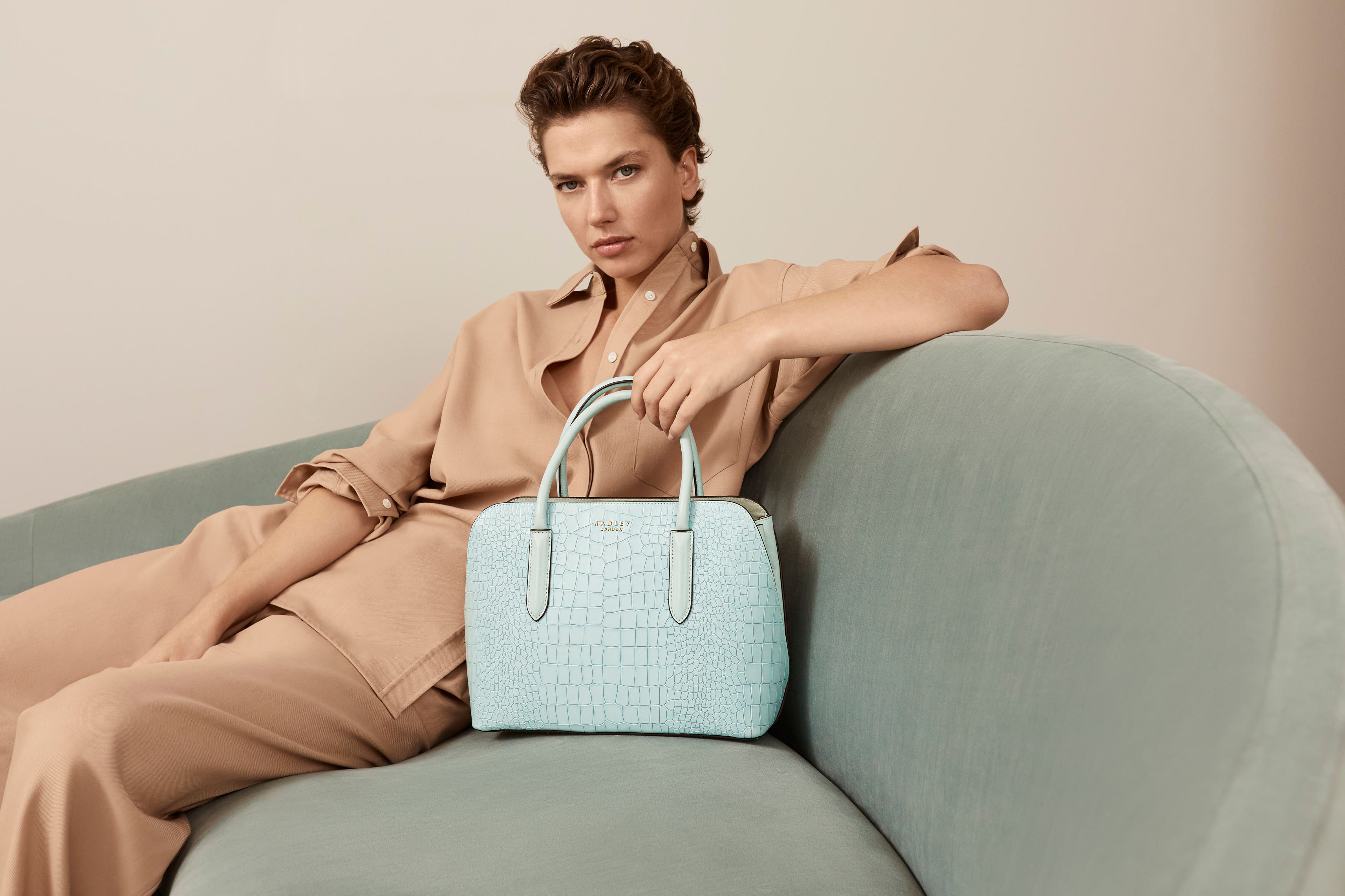 Hobo bags, top handles and woven styles are fresh for spring (Radley/PA)