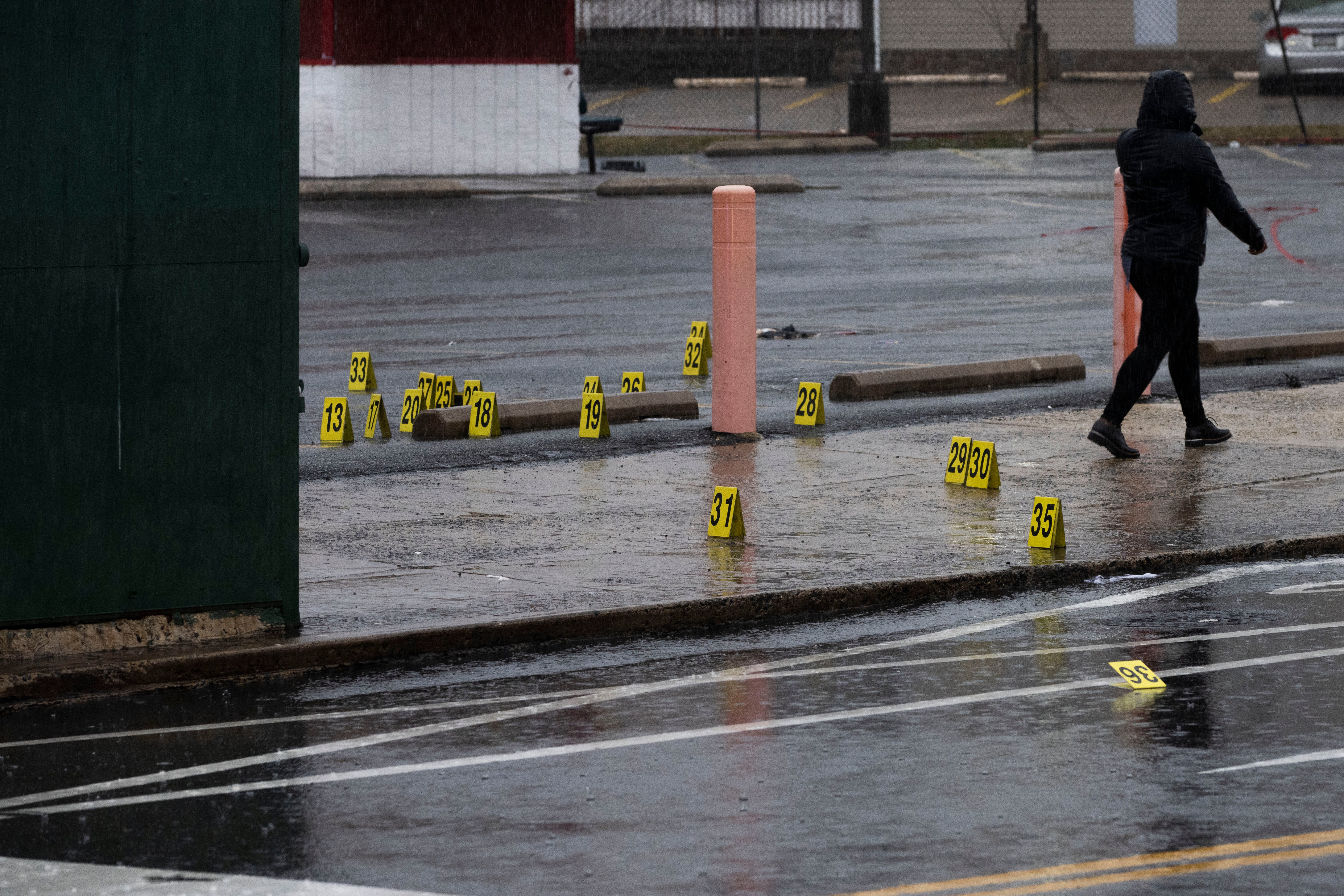 Evidence markers dot the ground following a shooting in northeast Philadelphia on Wednesday