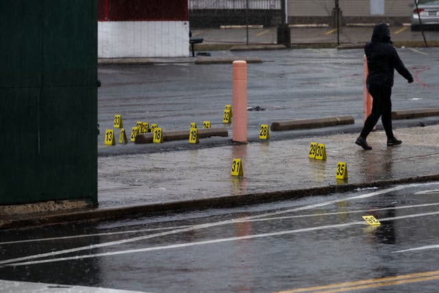 <p>Evidence markers dot the ground following a shooting in Northeast Philadelphia on Wednesday</p>