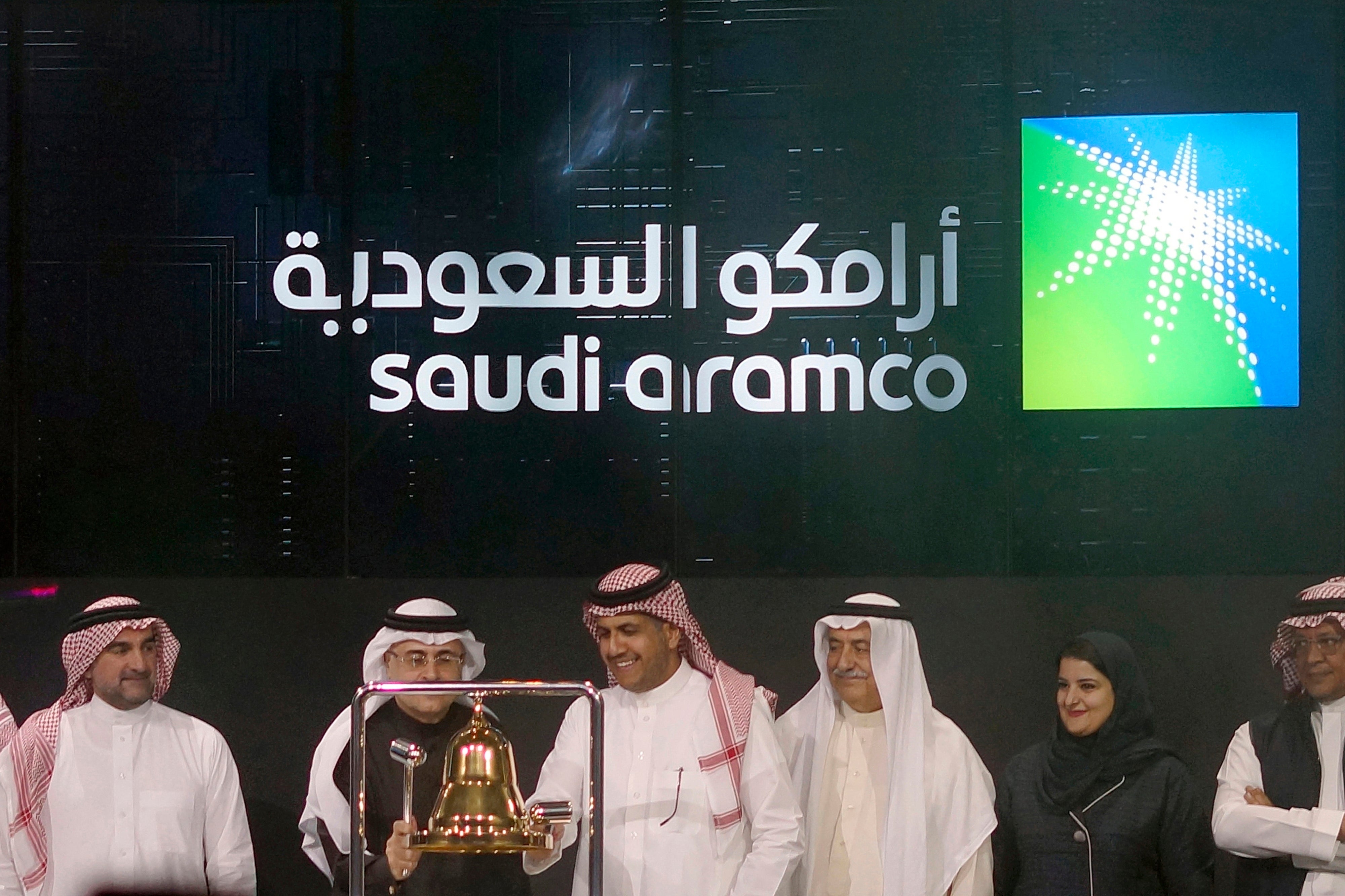 File imaghe: Saudi Arabia's state-owned oil company Aramco and stock market officials celebrate the debut of Aramco's initial public offering on the Riyadh Stock Market, in Riyadh in 2019.