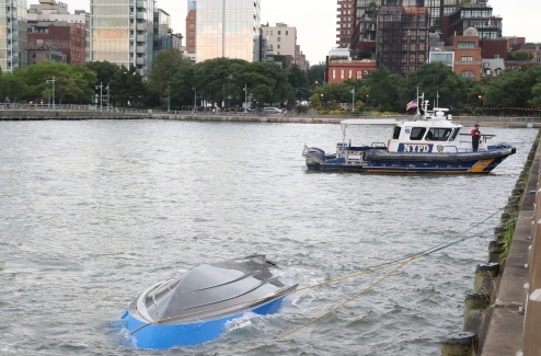 Picture shows the capsized boat in the Hudson River