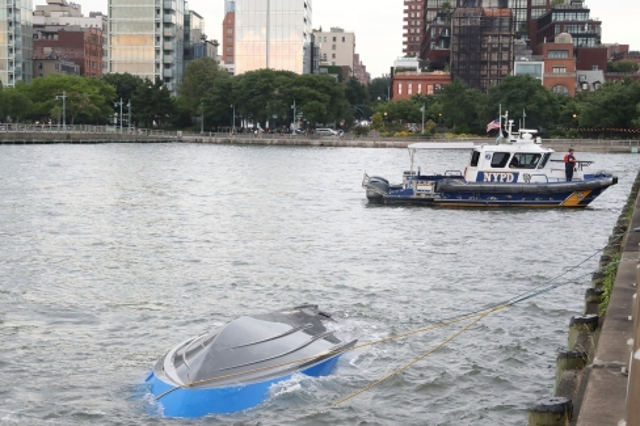 <p>Picture shows the capsized boat in the Hudson River </p>