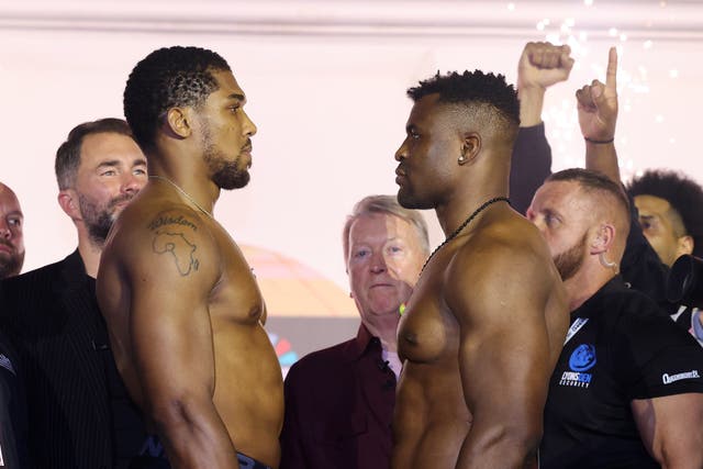 <p>Anthony Joshua (left) and Francis Ngannou after weighing in for their bout</p>