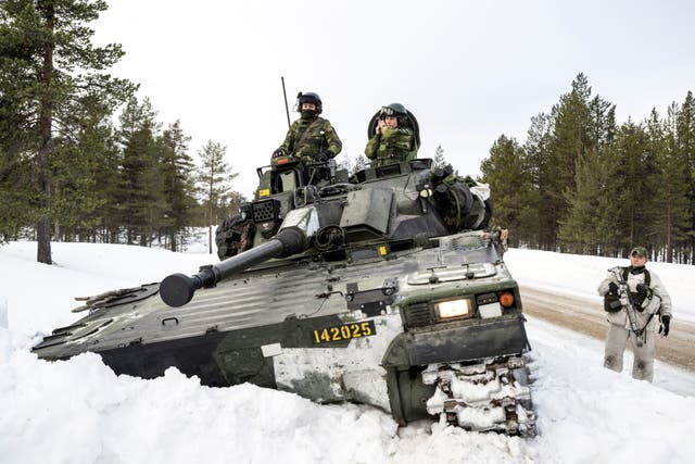 <p>Swedish soldiers operate on a Combat Vehicle 90 during training with Finnish hunting units as part of Nato’s Nordic Response exercise</p>