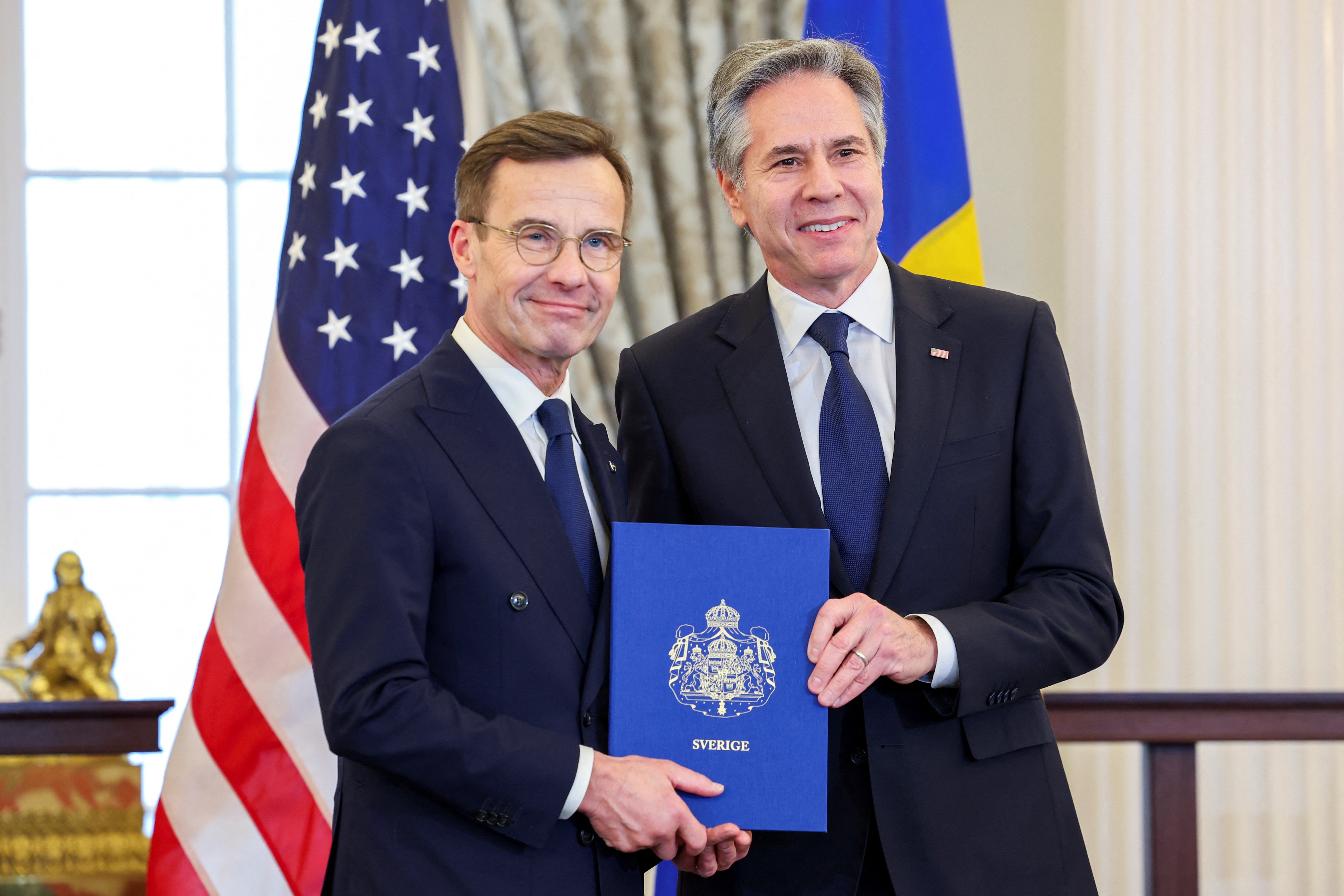 US Secretary of State Antony Blinken, right, accepts Sweden’s instruments of accession from Swedish Prime Minister Ulf Kristersson