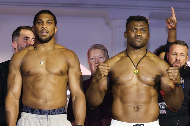 <p>Anthony Joshua (left) and Francis Ngannou after weighing in for their bout</p>