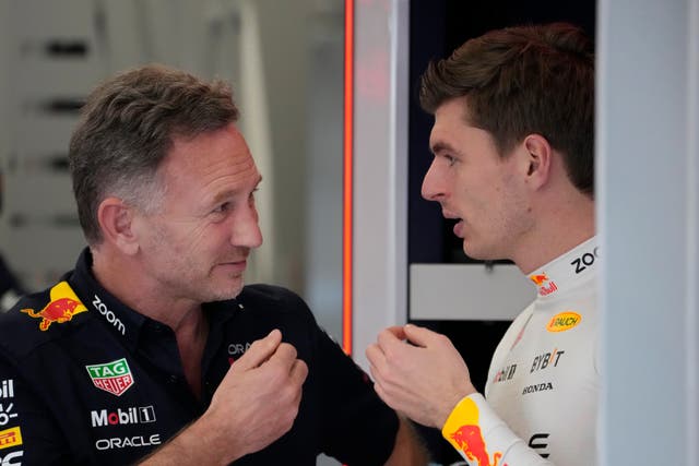 Red Bull team principal Christian Horner speaks to Max Verstappen ahead of practice (Darko Bandic/AP)