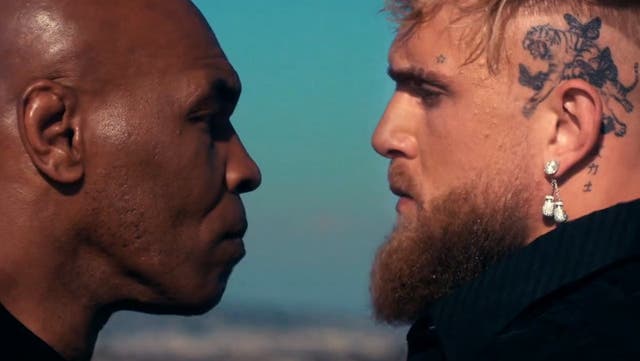 <p>Mike Tyson (left) facing off with Jake Paul </p>