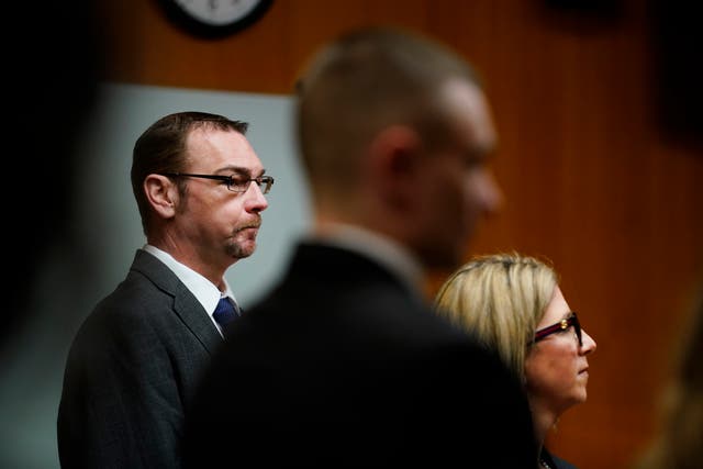 <p>James Crumbley, left, stands with his attorney Mariell Lehman as Oakland County Judge Cheryl Matthews swears in the jury before Crumbley’s trial on 7 March 2024</p>