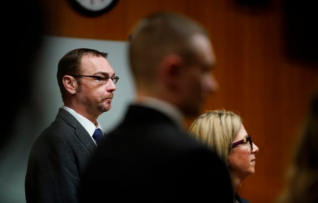 <p>James Crumbley, left, stands with his attorney Mariell Lehman as Oakland County Judge Cheryl Matthews swears in the jury before Crumbley’s trial on 7 March 2024</p>