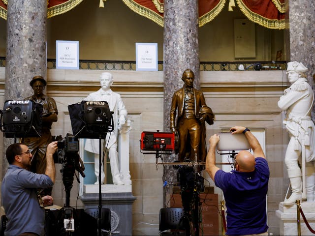 <p>Journalists set up equipment for TV networks in Statuary Hall in the US Capitol on 7 March 2024 in Washington, DC ahead of Joe Biden’s State of the Union speech</p>