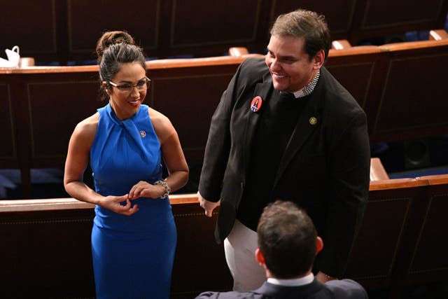 <p>US Representative Lauren Boebert (R-CO) talks with Rep. George Santos (R-NY) ahead of US President Joe Biden's State of the Union address in the House Chamber of the US Capitol in Washington, DC, on March 7, 2024</p>