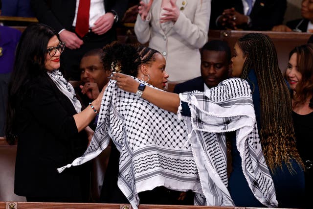 <p>U.S. Representatives Rashida Tlaib (D-MI), Cori Bush (D-MO) and Summer Lee (D-PA) put on Palestinian keffiyehs prior to U.S. President Joe Biden's State of the Union address at the U.S. Capitol in Washington, D.C</p>