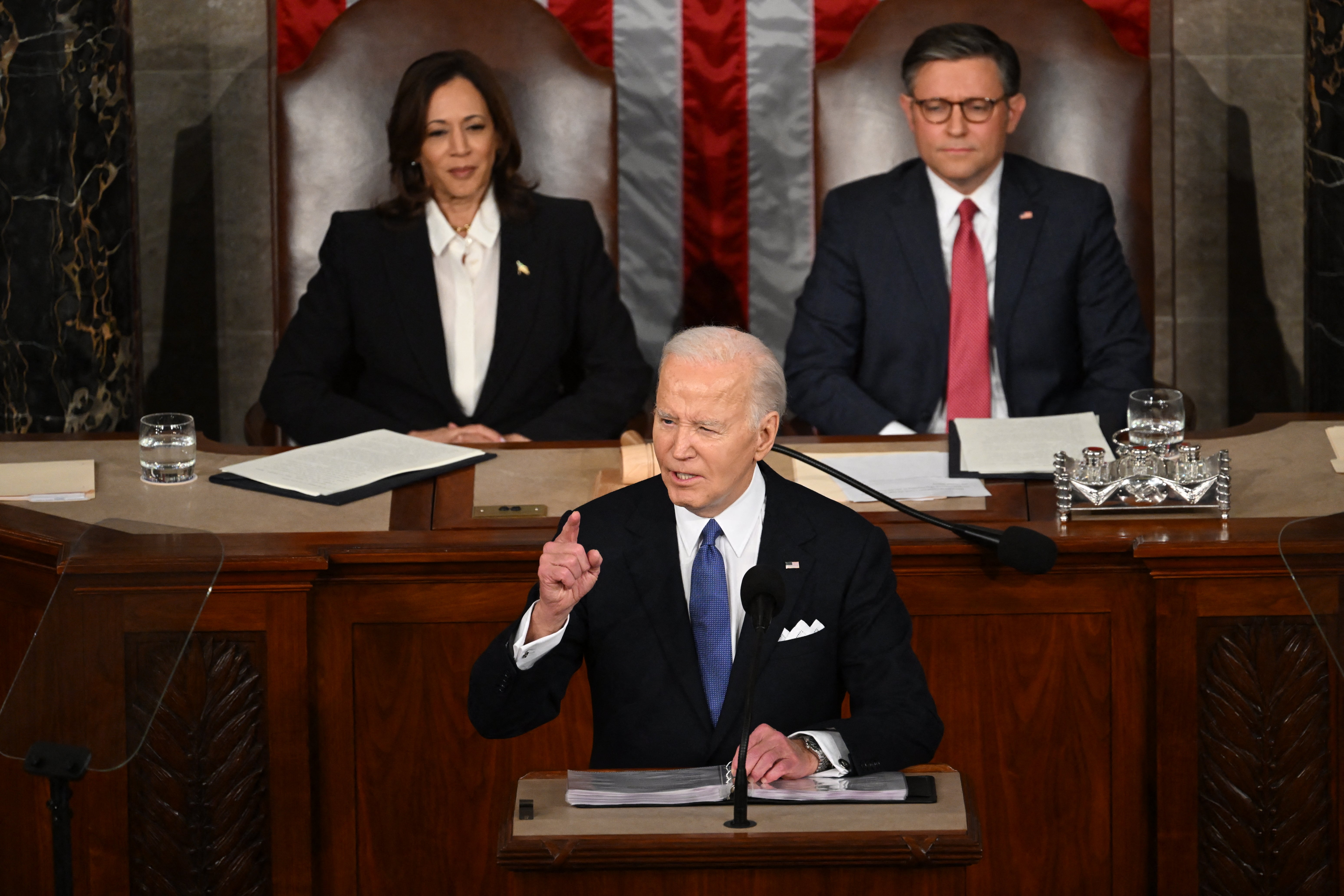 Biden speaks in front of Vice President Kamala Harris and Speaker of the House Mike Johnson